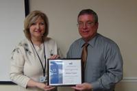 David Raby recognizes Donna Taylor’s 15-year milestone